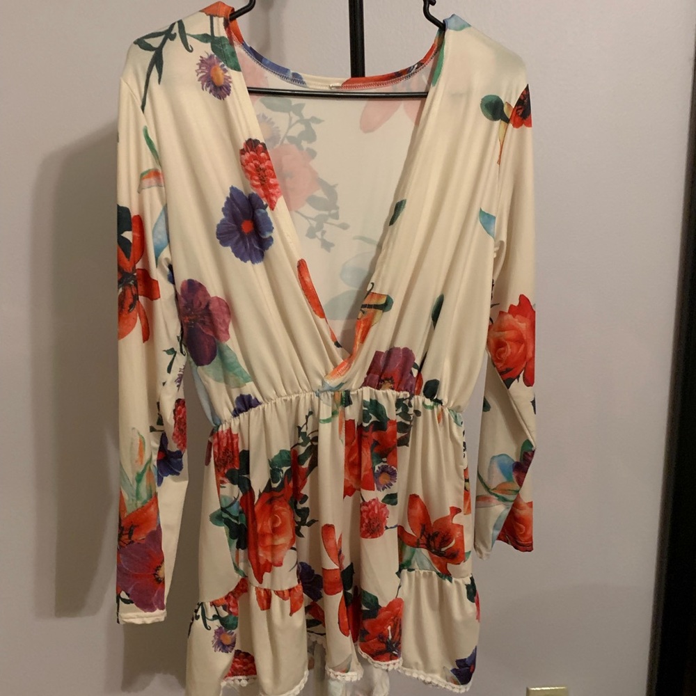 Cream romper with multi colored flowers